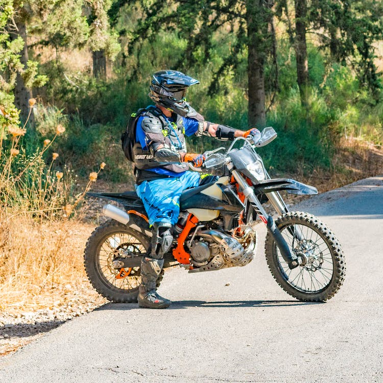 A man wearing safety gear while riding