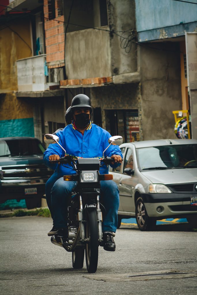 A man listening to music on a motorcycle